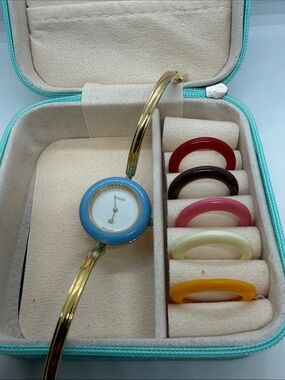 Gucci Gold Bangle Watch with Light Blue Bezel and Interchangeable Bezels